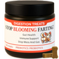 Jar of dog digestion treats with a black lid and colorful label on a white background